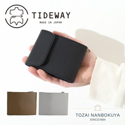 黒革取っ手アタバッグ - シックな上品さを添える巾着付きバッグ